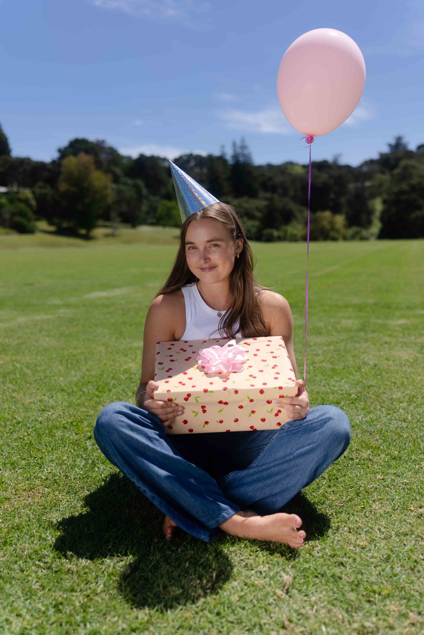Moo with a birthday balloon and present