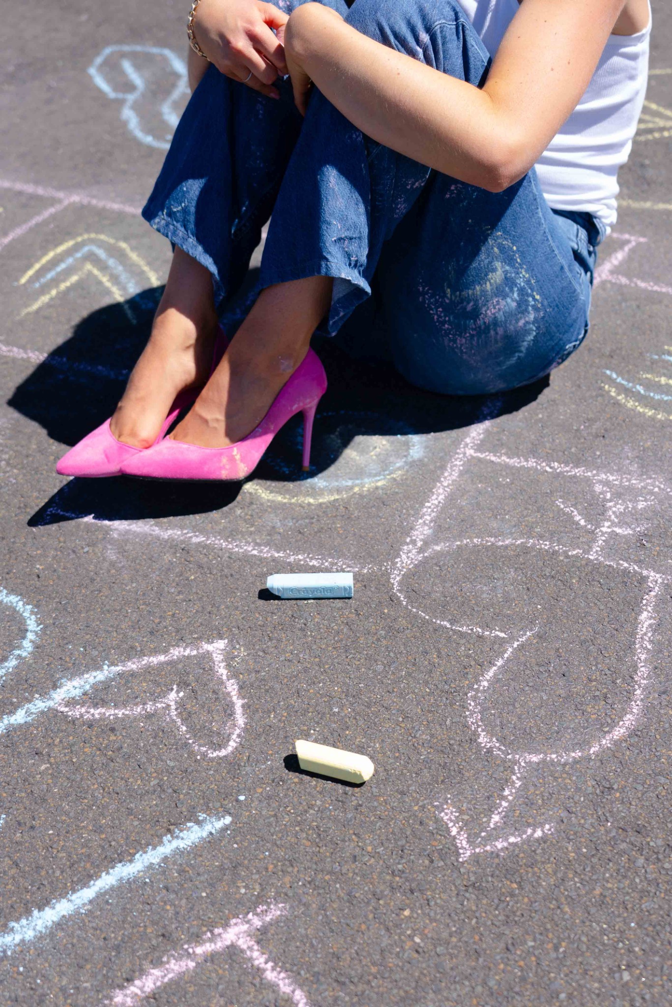 Pink heels among chalk drawings